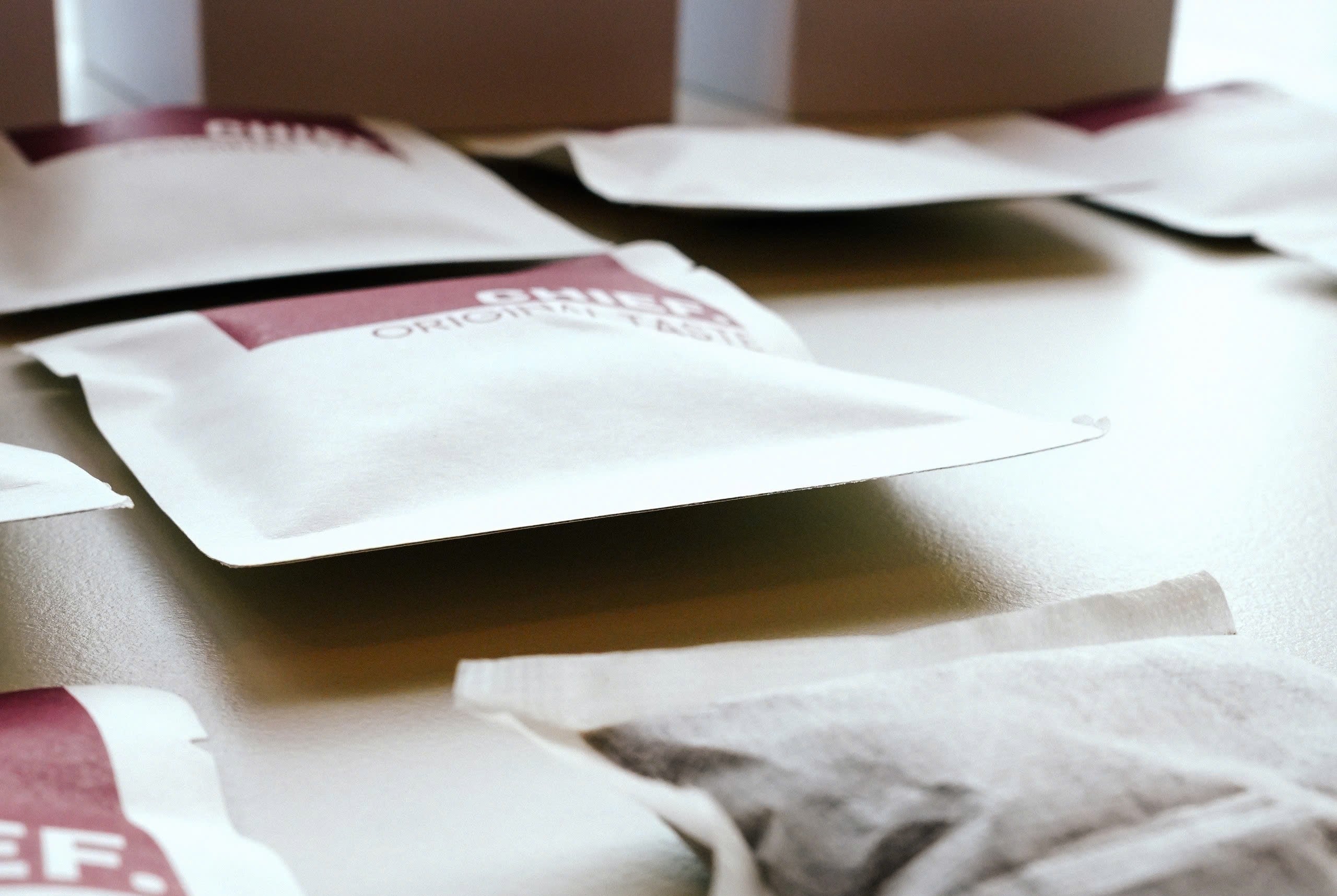 White packets with red labels on a surface, featuring the brand 'Chief'.